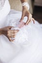 Bride pulls out a purse box with wedding rings or a gift from th