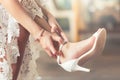 Bride put on wedding shoes on her feet Royalty Free Stock Photo