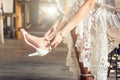 Bride put on wedding shoes on her feet Royalty Free Stock Photo