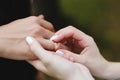 Bride puts the ring on the finger of the groom. Hands of groom and bride with rings Royalty Free Stock Photo