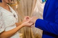 The bride puts the ring on her fiance hand Royalty Free Stock Photo