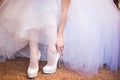 Bride puts on shoes