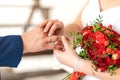 The bride puts a wedding ring on the finger of the groom. Wedding details Royalty Free Stock Photo