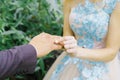 The bride puts a wedding ring on her finger to the groom Royalty Free Stock Photo