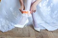 the bride putting on garter Royalty Free Stock Photo