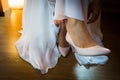 Bride putting on her high hilled shoes Royalty Free Stock Photo