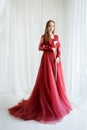 Bride in an red gown with calla flower in hands Royalty Free Stock Photo