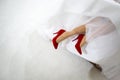 Bride in red shoes Royalty Free Stock Photo