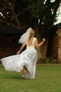 Bride running away Royalty Free Stock Photo