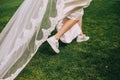 Bride run dress sneakers grass spring