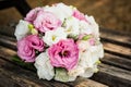 The brideÃ¢â¬â¢s bouquet on the day of the wedding is very delicate beautiful together with wedding rings Royalty Free Stock Photo