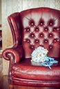 Bride's bouquet on a red armchair Royalty Free Stock Photo