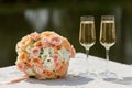 The bride's bouquet and two champagne glass Royalty Free Stock Photo