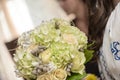 Bride's bouquet with white roses, hydrangea, green leaves