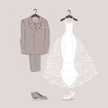 Bride's dress and groom's suit on hangers Royalty Free Stock Photo