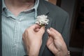 The bride`s father gets a corsage infected by the bride`s mother before a wedding, Germany Royalty Free Stock Photo