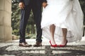 Bride`s and groom`s funny crossed legs