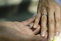 Bride`s and Groom`s hand holding together with the wedding rings Royalty Free Stock Photo