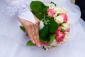 Bride's hand holding the bouquet Royalty Free Stock Photo