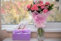 Bride`s shoes and bouquet near window Royalty Free Stock Photo