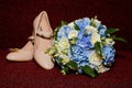 The bride`s shoes lie near the wedding bouquet Royalty Free Stock Photo
