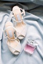 The bride`s shoes and perfume. Preparations for the wedding day. Royalty Free Stock Photo