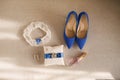 The bride`s wedding accessories are white and blue: shoes, ring cushion, perfume, garter and earrings Royalty Free Stock Photo