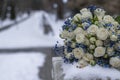 Bride\'s wedding bouquet lies on a stone slab