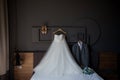 The bride`s white wedding dress, shoes, jacket and groom`s shirt Royalty Free Stock Photo