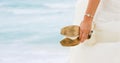 Bride with shoes in hands Royalty Free Stock Photo