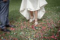 Bride shoes stepping on confetti on the floor Royalty Free Stock Photo