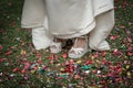 Bride shoes stepping on confetti on the floor Royalty Free Stock Photo