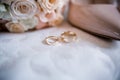 Bride shoes with wedding gold rings and bouquet Royalty Free Stock Photo