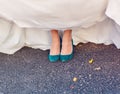 Bride show off her turquoise shoes at wedding