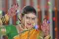 Bride showing henna on her hands hands in Indian Hindu wedding