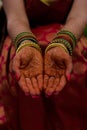 Bride showing the mehendi on her hands