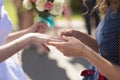 Bride shows ring to girlfriend, close-up of hands