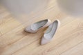 The bride shows white wedding shoes. Wedding detail. Close up Royalty Free Stock Photo