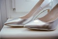 The bride shows white wedding shoes. Wedding detail. Close up Royalty Free Stock Photo