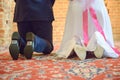 The bride shows white wedding shoes. Wedding detail. Close up Royalty Free Stock Photo