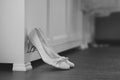 The bride shows white wedding shoes. Wedding detail. Close up Royalty Free Stock Photo