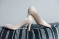 The bride shows white wedding shoes. Wedding detail. Close up Royalty Free Stock Photo