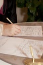 Bride Signing Marriage Certificate