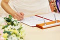 Bride signing marriage license or contract Royalty Free Stock Photo