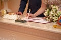 bride signs the log in the registry office. a young wife and husband. wedding. marriage registration. Royalty Free Stock Photo