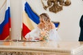 bride signs the marriage certificate in the registry office. Royalty Free Stock Photo