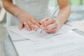 The bride signs the marriage registration documents. Young couple signing wedding documents. Royalty Free Stock Photo