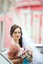 The bride in simple retro dress with floral