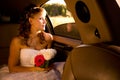 Bride is sitting in limousine Royalty Free Stock Photo