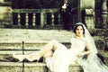 Bride sitting on stairs Royalty Free Stock Photo